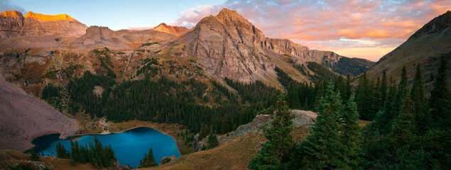 A brilliant pano of sunrise at the lower Blue Lake in Mount Sneffels Wilderness, Ridgeway, Colorado during the falls season. A backpacking adventure. 