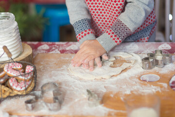 children's hands make cookies from dough