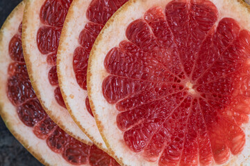 Texture of a ripe grapefruit slice. Close up