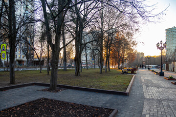 PUSHKINO, RUSSIA, on November 17, 2020. Urban view in the fall sunset. Trees in the boulevard