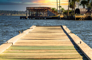 small fishing pier leading into the lake