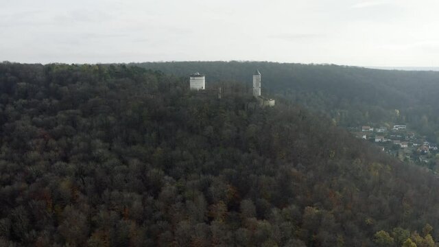 The fairytale castle burg Plesse in Bovenden near G&ouml;ttingen Goettingen at sunrise, Lower Saxony, Germany. Drone aerial shot of the Plesseburg in late autumn.