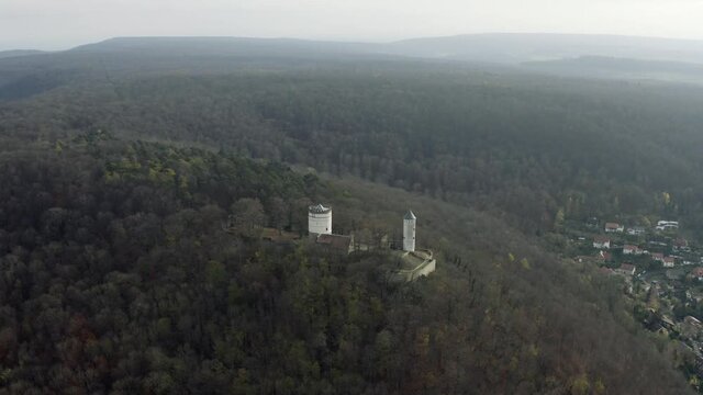 The fairytale castle burg Plesse in Bovenden near G&ouml;ttingen Goettingen at sunrise, Lower Saxony, Germany. Drone aerial shot of the Plesseburg in late autumn.