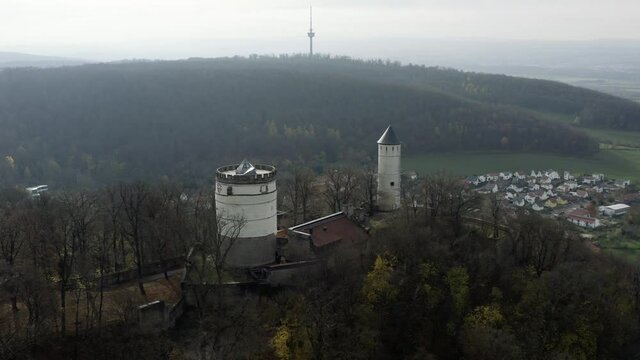 The fairytale castle burg Plesse in Bovenden near G&ouml;ttingen Goettingen at sunrise, Lower Saxony, Germany. Drone aerial shot of the Plesseburg in late autumn.