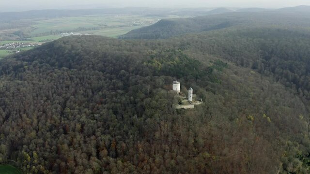 The fairytale castle burg Plesse in Bovenden near G&ouml;ttingen Goettingen at sunrise, Lower Saxony, Germany. Drone aerial shot of the Plesseburg in late autumn.