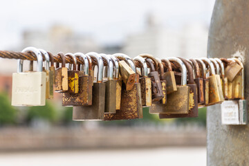 View to love promise padlocks on bridge rail in Puerto Madero