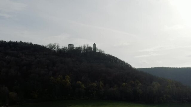 The fairytale castle burg Plesse in Bovenden near G&ouml;ttingen Goettingen at sunrise, Lower Saxony, Germany. Drone aerial shot of the Plesseburg in late autumn.