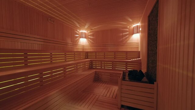 the inside of the sauna. 4K. Standard wooden sauna room interior