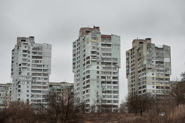 abandoned high-rise building of the Soviet Union in the winter in the city