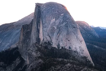 Wall murals Half Dome A sunrise over Half Dome in Yosemite National Park, California. 
