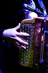 Accordion and human hands playing