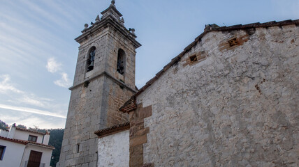 Church and tower bell in the village of Ain, (Spain)