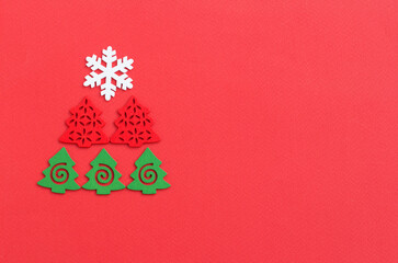 creative new year or christmas tree on red background with place for text