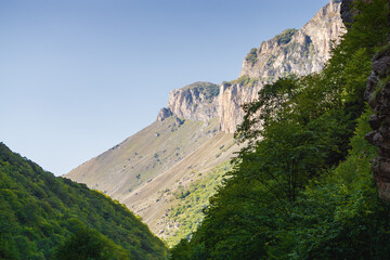 Sunny view of  mountains and Eltyulbyu village in North Caucasus, Kabardino-Balkaria, Russia.