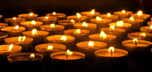 Burning candles. Shallow depth of field. Many christmas candles burning at night. Abstract candles...