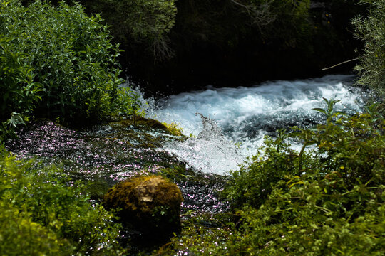 Water leaping out of a river's waterfall