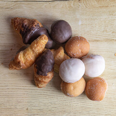 small pieces of pastries put together on a wooden board