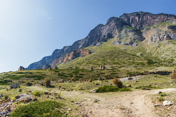 Fototapeta na wymiar Sunny view of mountains and Eltyulbyu village in North Caucasus, Kabardino-Balkaria, Russia.