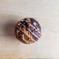 white chocolate chip muffin and liquid caramel wrapped in paper
