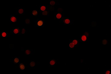 Bokeh of red lights on black background