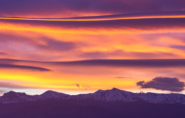Large lenticular clouds over Sierra Nevada at sunrise