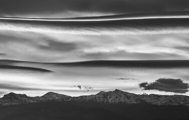 Large lenticular clouds over Sierra Nevada at sunrise
