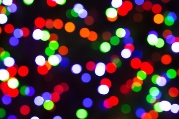 Festive Christmas lights background. Blurred pattern - bokeh with light.
