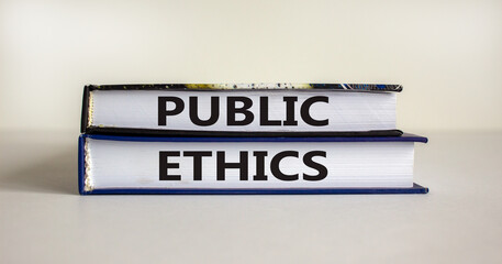 Public ethics and business concept. Books with words 'public ethics'. Beautiful white background. Copy space.