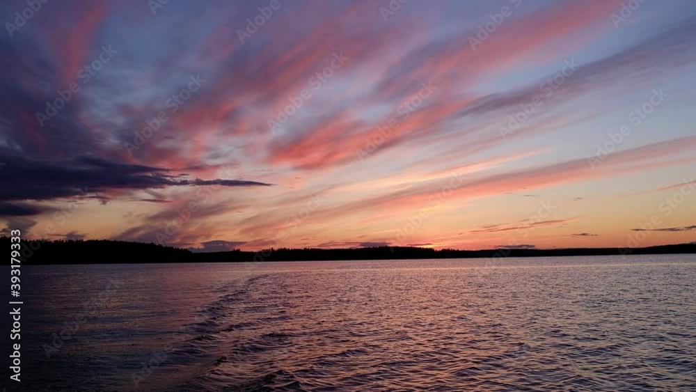 Poster sunset on the lake. view from a floating boat