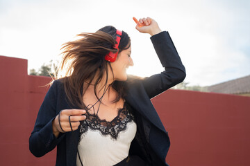 beautiful woman dancing with music headphones