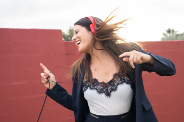 beautiful woman dancing with music headphones
