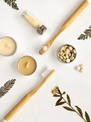 Fototapeta na wymiar Bamboo toothbrushes, toothpaste in tablets, dental floss, candles and dried flowers. Knolling creative flatlay. Ecology, zero waste.