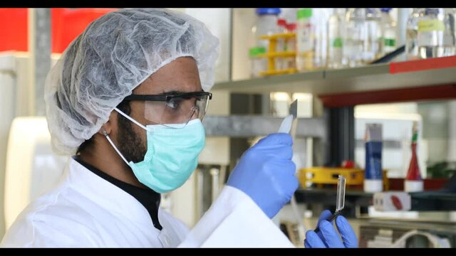 scientist looking to a sample in a laboratory