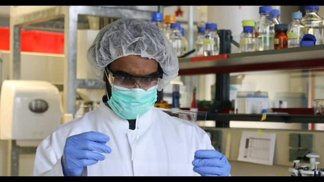 scientist looking to a sample in a laboratory