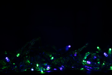Colorful multicolored Christmas lights background. Holidays.