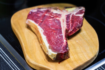 Raw prime T-Bone marbled beef steak ready for grill