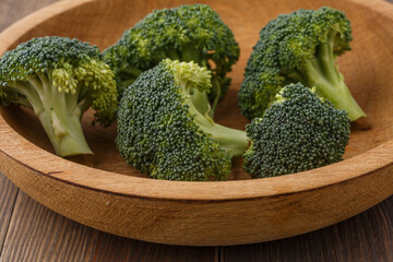  A lot of broccoli for diet and healthy eating. Fresh green broccoli on a   table.Broccoli vegetable is full of vitamin.Vegetables for diet and healthy eating.Organic food.