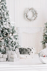 Luxurious Christmas tree decorated with lights with gifts. Happy New Year 2021. Christmas concept.