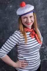 Beautiful midle aged lady having fun in sailor's suit