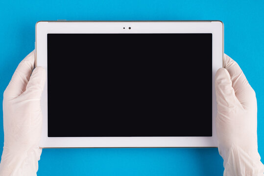 Top Above Overhead Pov First Person View Photo Of Therapist Physician In Latex White Gloves Using Tablet To Track Diagnosis Isolated On Blue Background