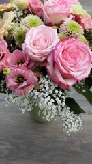 bouquet of roses on wooden background 