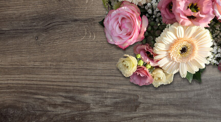 bouquet of roses in the upper right on wooden background  - copy space