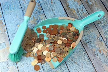 British coins in a dust pan. Dirty money concept.