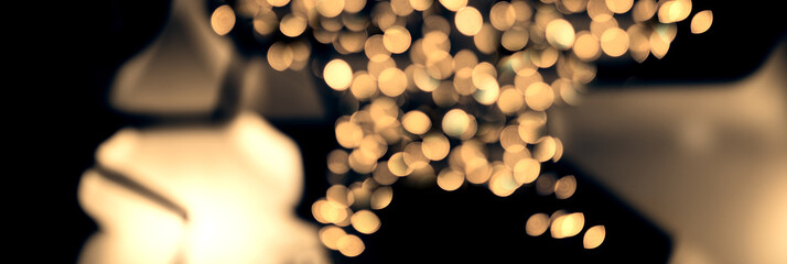 Magical Christmas - defocused, abstract, shiny golden star fairy lights with magnificent bokeh...