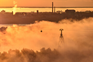 dawn over the cable car across the river