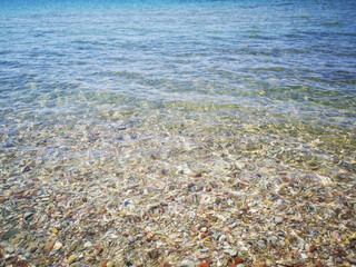Fototapeta na wymiar sea and stones, clear sea water