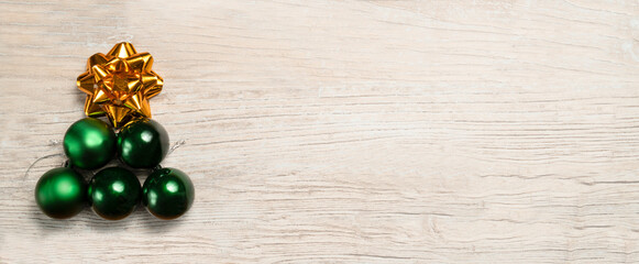 Christmas background with a Christmas tree with baubles and a golden star