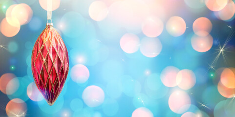 Christmas tree ornament on blue backgrpund with bokeh