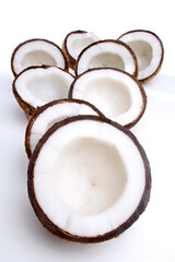 Studio shot of halved coconuts