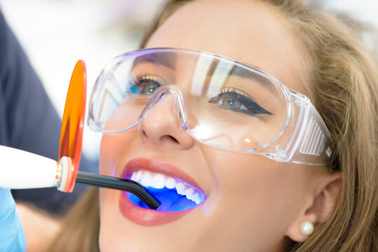 Dentist Using Ultraviolet Lamp